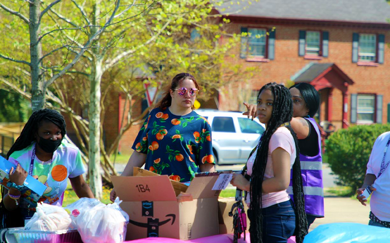 Community members offering support at an outdoor gathering