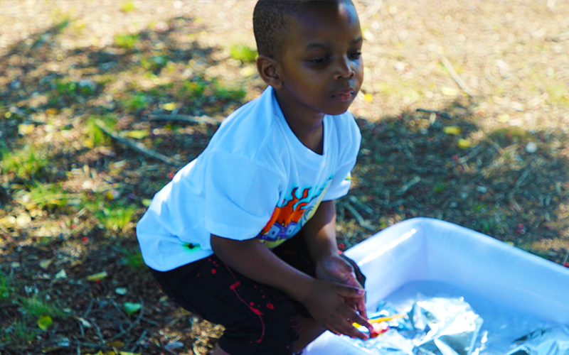 A child taking part in a community activity